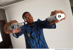 Garson STANDING POSE WITH GUNS 